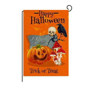 Detail of linen Halloween garden flag featuring orange pumpkin and skull grave prints