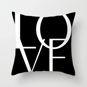 Modern black throw pillow cover featuring white LOVE letter art in a square canvas