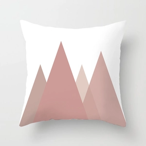 Detail showing pink geometric mountain pattern on a modern white decorative pillow case
