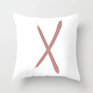 Detail of white square cushion cover with pink watercolor 'X' letter art print
