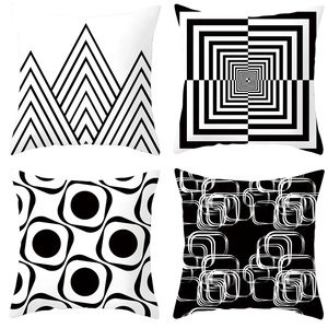 Detail view of four minimalist black and white geometric pattern square cushion covers