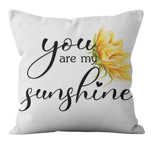 Close-up of white daisy pillowcase fabric texture with You Are My Sunshine print