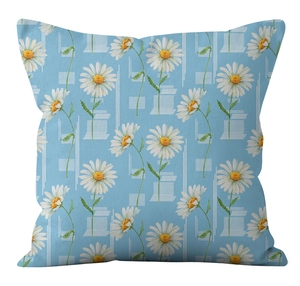 Close-up of fresh daisy floral pattern on light blue decorative square pillow cover