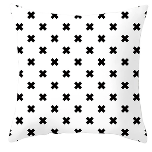 Minimalist black and white square pillowcase with geometric X patterns on a clean background