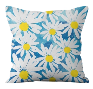 Detailed close-up of daisy print pattern and woven texture on a blue decorative pillowcase