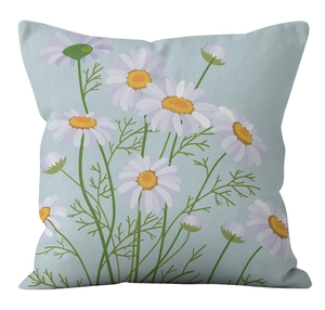 Macro detail of daisy floral print on light blue textured canvas cushion cover