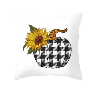 Detail of sunflower and buffalo plaid pumpkin pattern on a white festive pillow cover