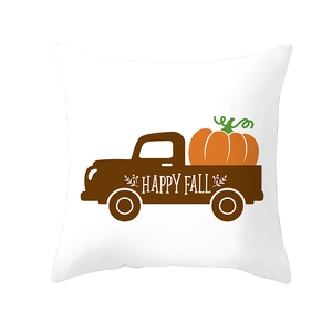 Detail view of Happy Fall pumpkin pickup truck pattern on smooth white cushion cover