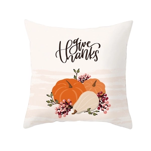 Detail view of Thanksgiving pillowcase featuring orange pumpkins and Give Thanks text