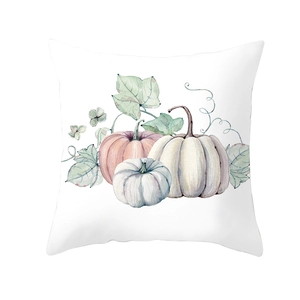Macro shot of watercolor pumpkin print on high-quality square pillowcase fabric detail