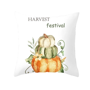 Detail of harvest pumpkin watercolor design on a white linen Thanksgiving cushion cover