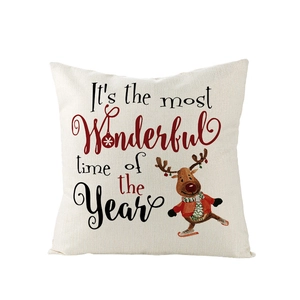 Détail d'une housse de coussin de Noël en lin avec renne et inscription festive
