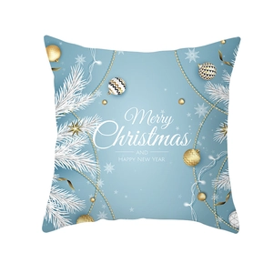 Detail of light blue Christmas pillowcase with gold ornaments and pine branch patterns