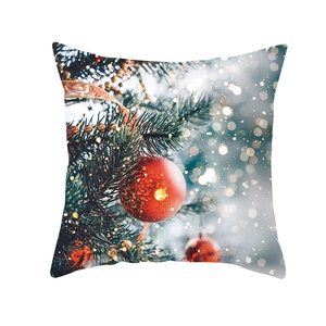 Detailed view of Christmas pillowcase with festive red bauble and gold chain design
