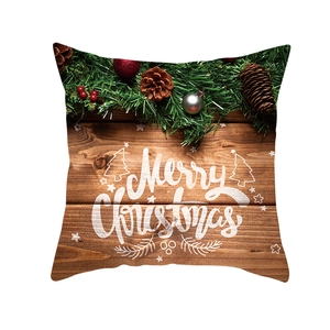 Detail of Christmas pillowcase with pine needles, red berries and Merry Christmas print