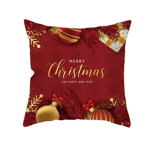 Red Christmas pillow cover with golden Merry Christmas text and festive ornaments