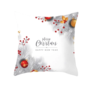 Detail of Christmas cushion cover with red ornaments and Merry Christmas typography