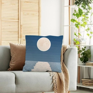 Nordic decorative pillow case with moon and ocean print on a grey sofa