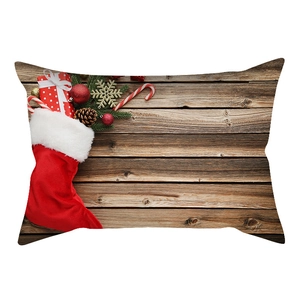 Detailed Christmas lumbar pillow cover featuring festive patterns on dark wood background