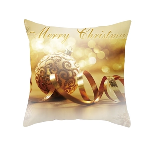 Dettaglio del copricuscino dorato Merry Christmas con motivo a sfera d'oro e nastri