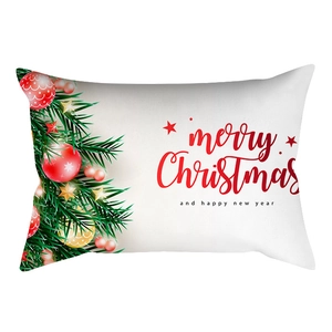 Close-up of white Christmas lumbar pillow cover with festive tree and merry text
