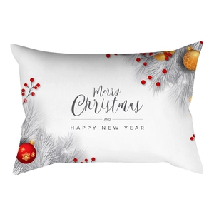 Close-up of lumbar pillowcase featuring festive pine needles, red berries, and Christmas ornaments