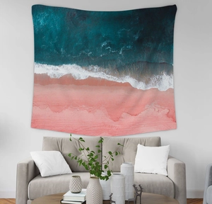 Nordic wall tapestry with aerial pink beach and blue sea landscape in a modern living room
