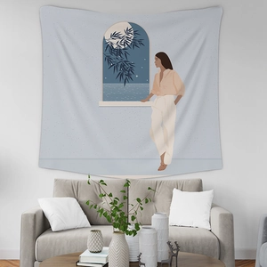 Detailed view of modern illustration tapestry hanging above a sofa in a minimalist room