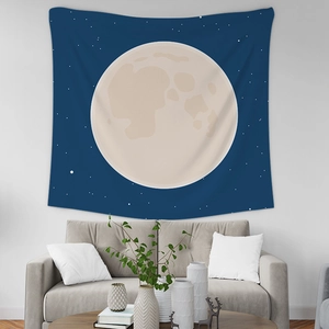 Artistic moon and starry sky tapestry hanging above a sofa for bedroom wall decor