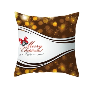 Dettaglio della fodera per cuscino di Natale con campane d'oro e stampa Merry Christmas