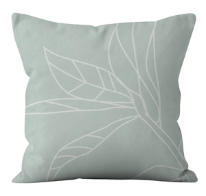 Detail of grey-green cushion cover with white botanical leaf line art on linen fabric
