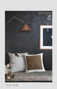 Detailed scene show of abstract art pillow covers on a stylish grey striped bench