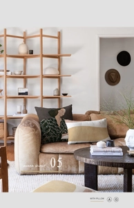 Abstract art pillow covers with minimalist portrait and wave design on a modern leather sofa