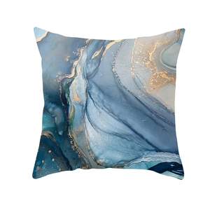 Detailed close-up of blue ink abstract cushion cover with golden fluid marbling textures