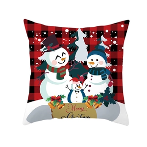 Detail of red and black buffalo plaid Christmas pillowcase featuring a snowman family motif