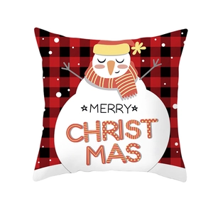 Detail view of snowman buffalo plaid Christmas pillowcase with Merry Christmas text