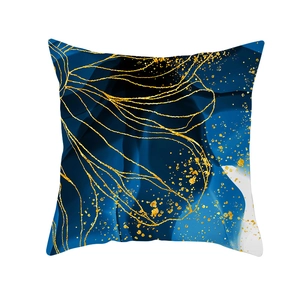 Detail of blue marble fluid texture cushion cover with abstract gold ink and gilding