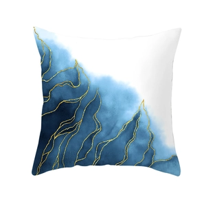 Detail of blue ink abstract pillow cover with elegant gold veins on white fabric