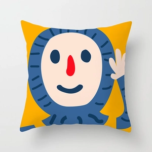 Close-up of peach skin pillowcase with cute yellow cartoon face and blue striped hat