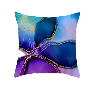 Detail shot of square pillowcase with blue ink abstract fluid art and golden lines