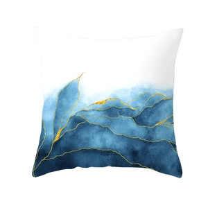 Detail of blue ink art pillowcase with gold line accents on a white textured fabric