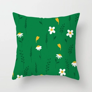 Detail of green daisy throw pillow cover showing fine canvas texture and floral print