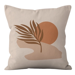 Detail of short plush cushion cover with bohemian palm leaf and abstract sun print