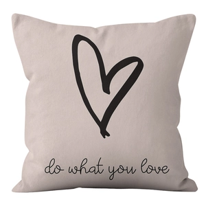 Detail of soft velvet cushion cover with heart print and do what you love slogan