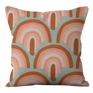 Detail of soft velvet cushion cover with Nordic abstract rainbow patterns in warm tones