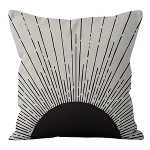 Detail of Nordic throw pillow cover with abstract sunburst pattern on beige fabric