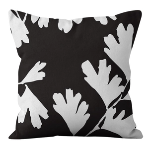 Detail of Nordic cushion cover showing abstract leaf patterns on textured fabric