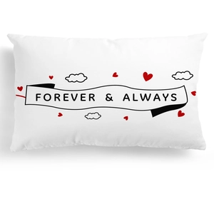 Macro detail of white wedding pillowcase with Forever & Always print and red hearts