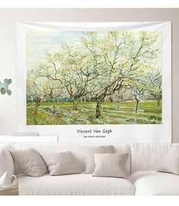 Detail of The White Orchard tapestry by Van Gogh hanging above a modern sofa in a living room