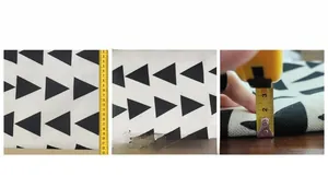 Close-up of linen fabric with black geometric patterns showing precise size measurements
